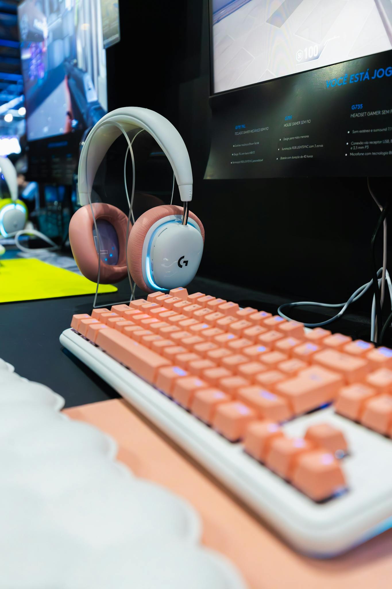 Home Stylish gaming setup featuring a pink mechanical keyboard and wireless headset