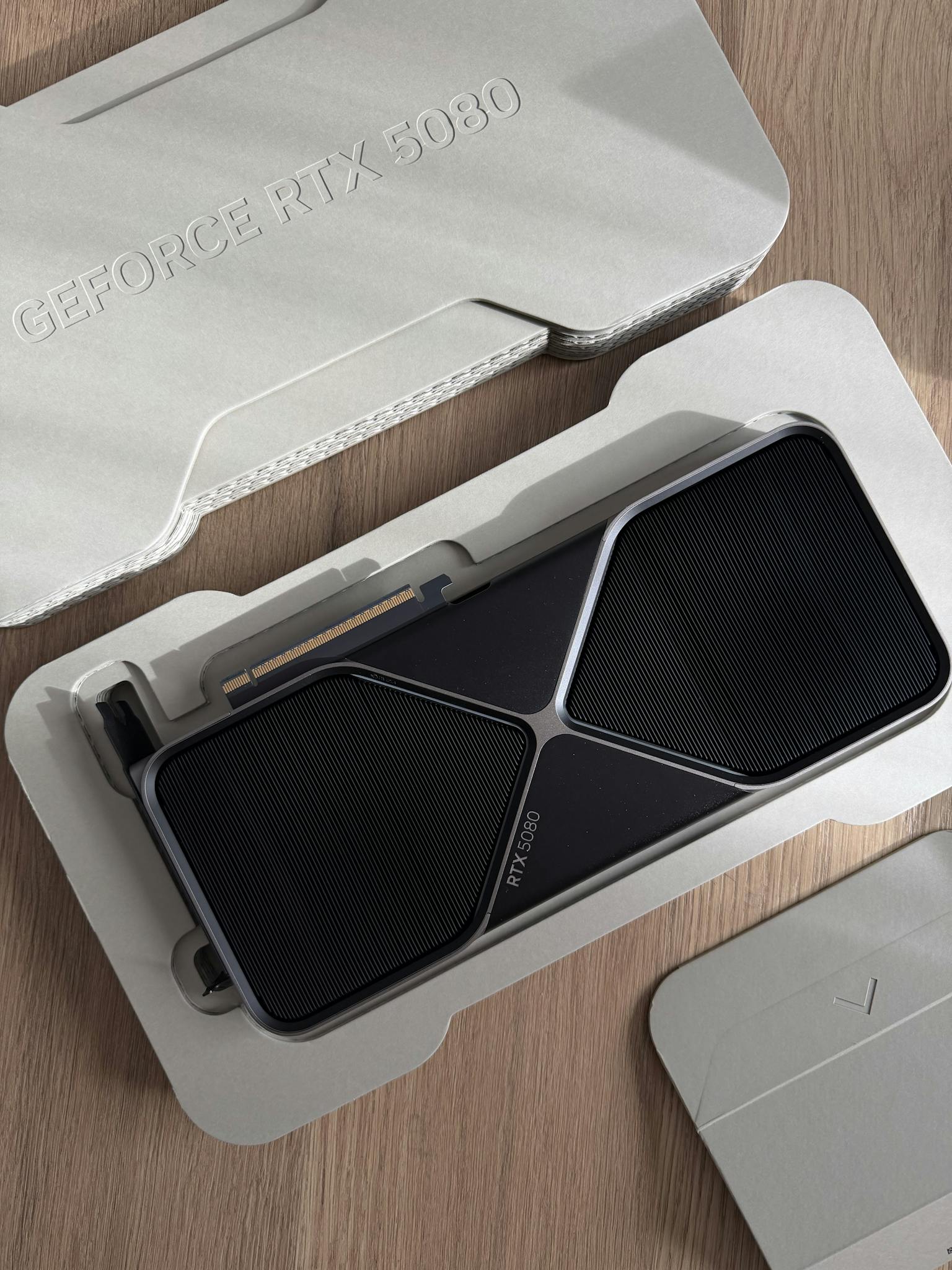 Home Top view of a GeForce RTX 3080 graphics card in premium packaging.