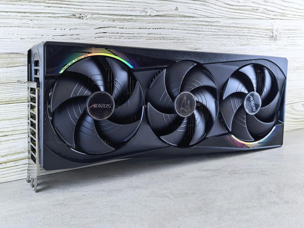Triple fan GPU with RGB lighting, ideal for gaming setups and high-performance computing.
