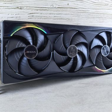 Triple fan GPU with RGB lighting, ideal for gaming setups and high-performance computing.